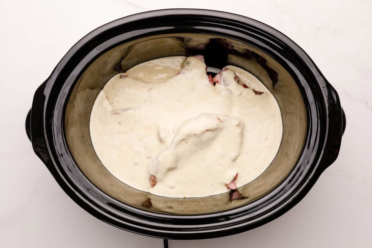 Sauce and pork in a crockpot.