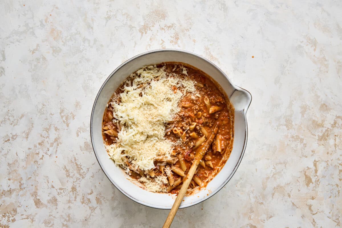 Penne pasta with sauce and cheese.