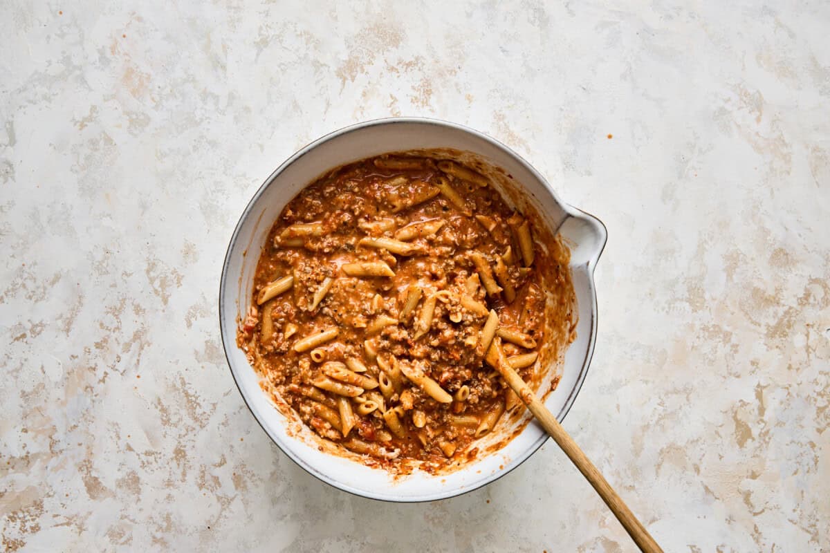 Penne pasta mixed with marinara.