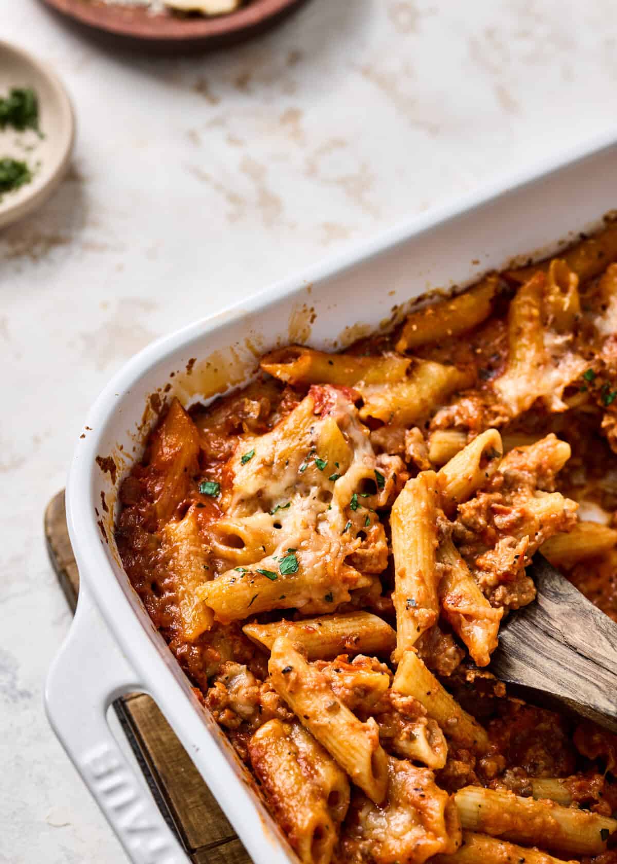 penne pasta bake being scooped.