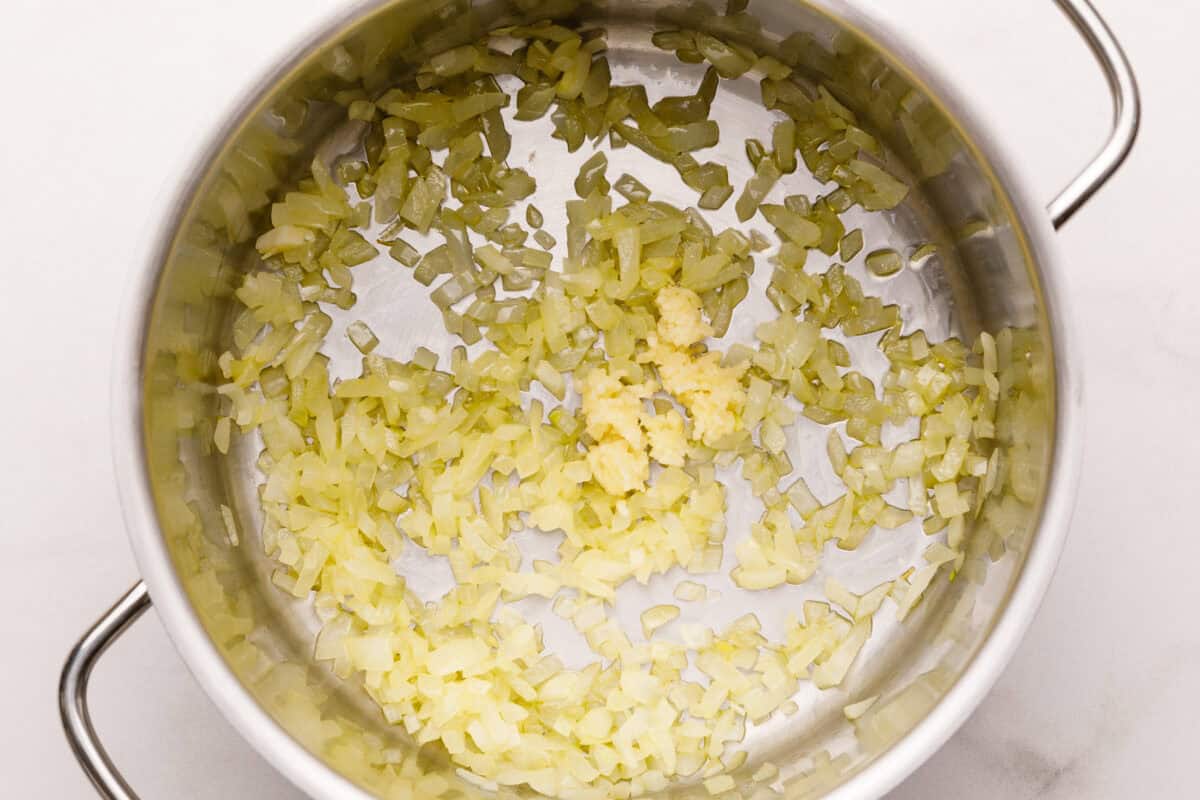 Cooking garlic and onions for tomato soup.
