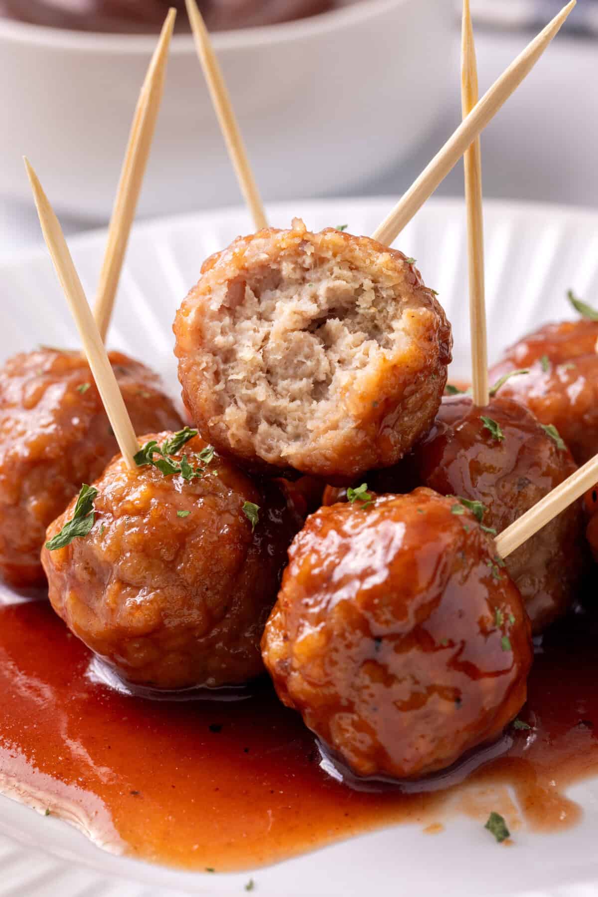 Grape jelly meatballs with toothpicks.
