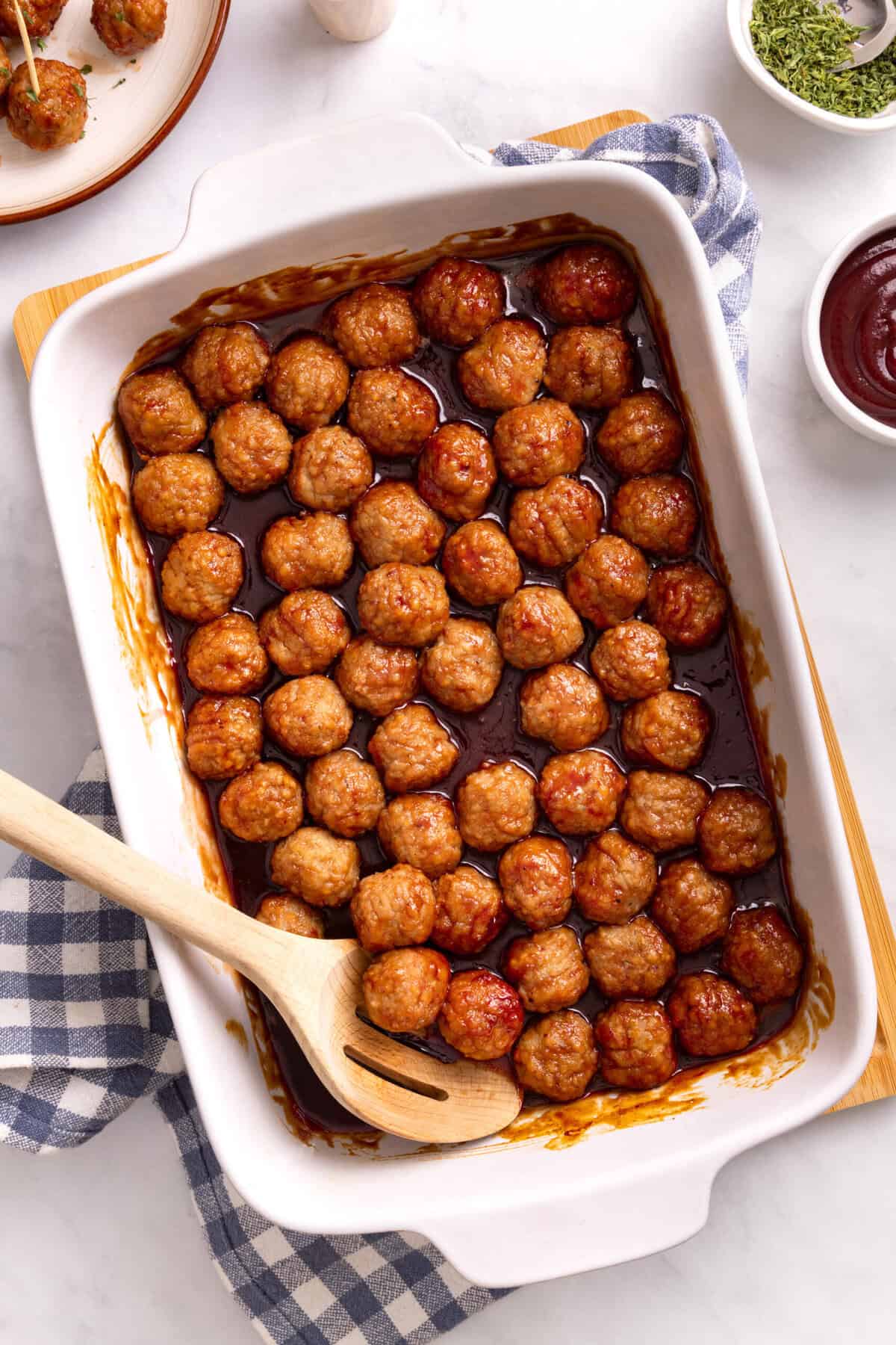 grape jelly meatballs in a casserole dish.