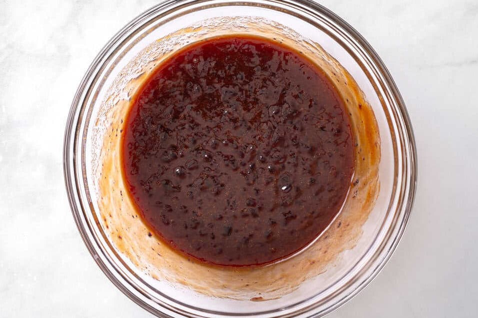 Sauce for meatballs in mixing bowl.