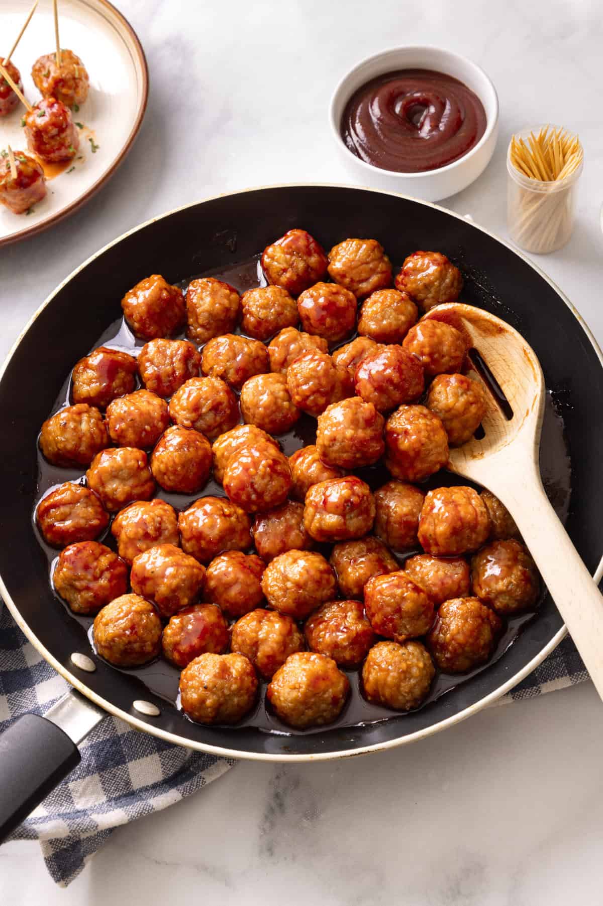 grape jelly meatballs in a skillet.