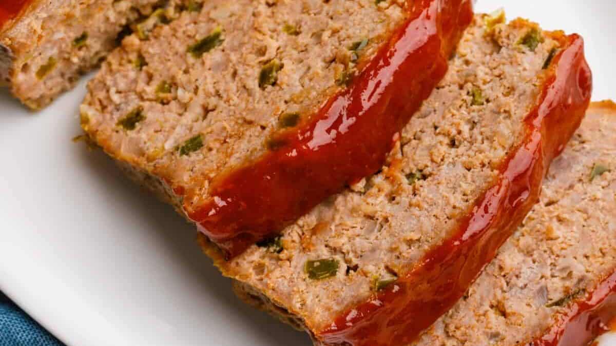 Sliced southern meatloaf on a plate.