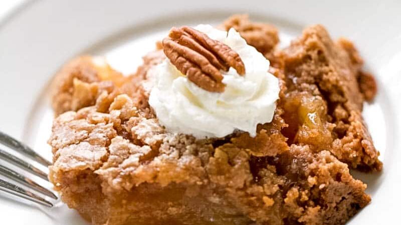This apple dump cake is the easiest dump cake recipe, with three basic ingredients. If you are looking for an easy fall dessert, this recipe is just that.  Tender bits of apple in every bite covered with a spiced cake that is delicious, down to the last bite. An easy apple dessert you can whip up any time of day. #apple #dessert #dumpcake #falldessert #appledessert #easydesserts| allthingsmamma.com