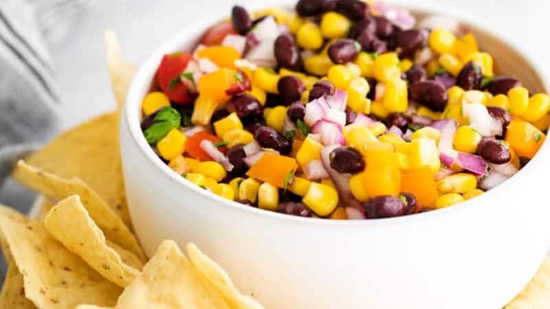 Black Bean and Corn Salsa in white bowl with chips