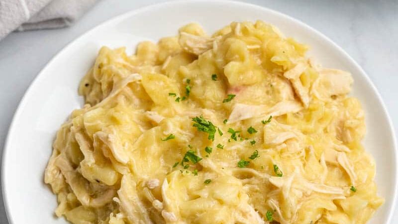 Chicken pasta served on a round white plate