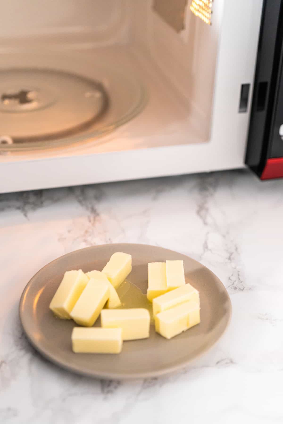 Softened sticks of unsalted butter on in the microwave.