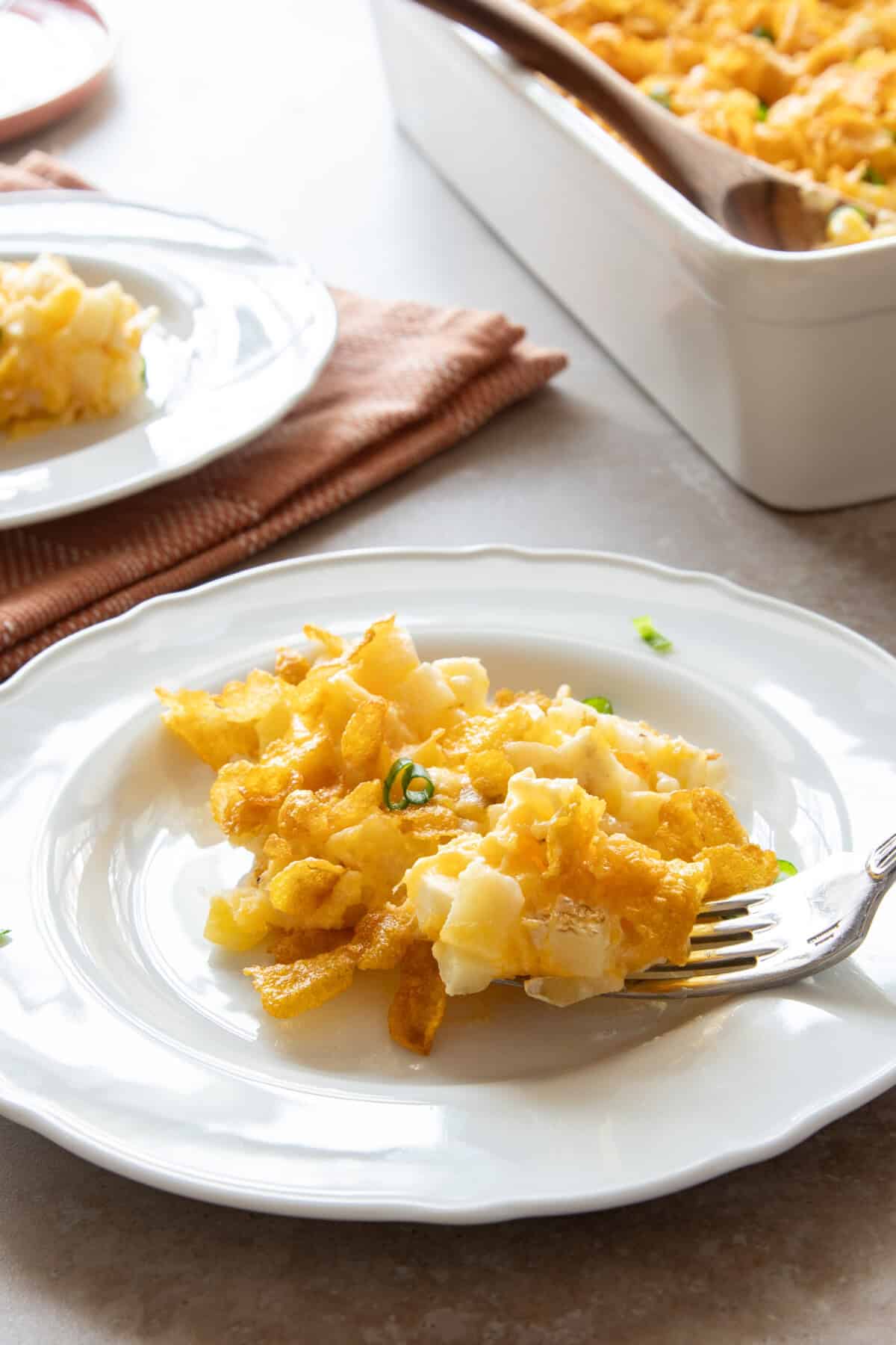 Cheesy Potatoes Plate of cheesy potatoes with fork