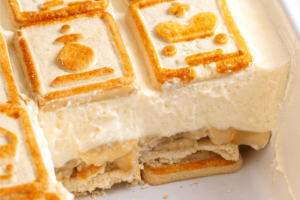 Chessman banana pudding in a baking dish with servings missing.
