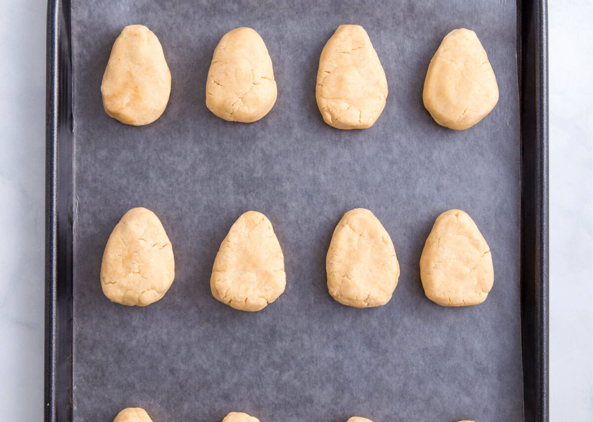 The shaped filling on a baking sheet with a piece of parchment paper on it before chilling.