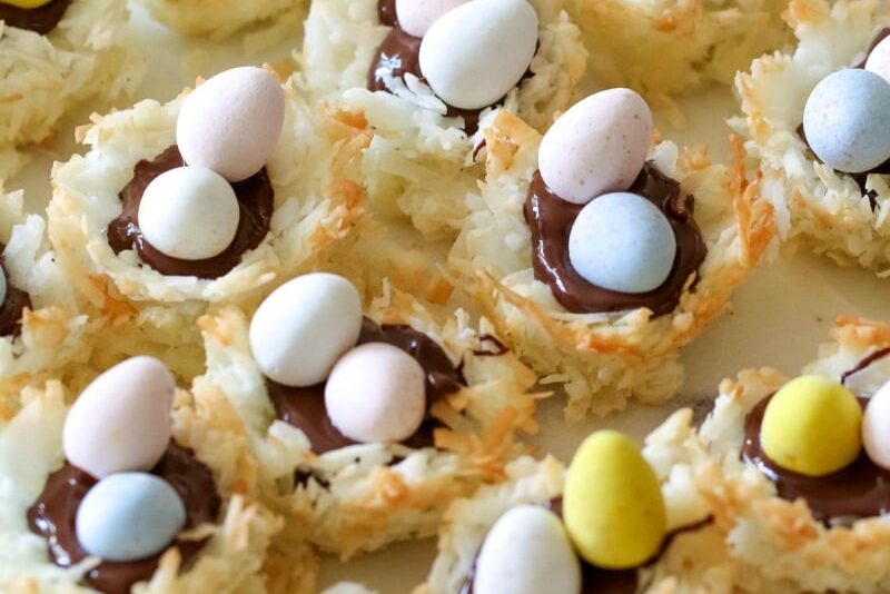 These Coconut Macaroon Nests are filled with dark chocolate and topped with Mini Cadbury Eggs for an adorable and tasty treat!