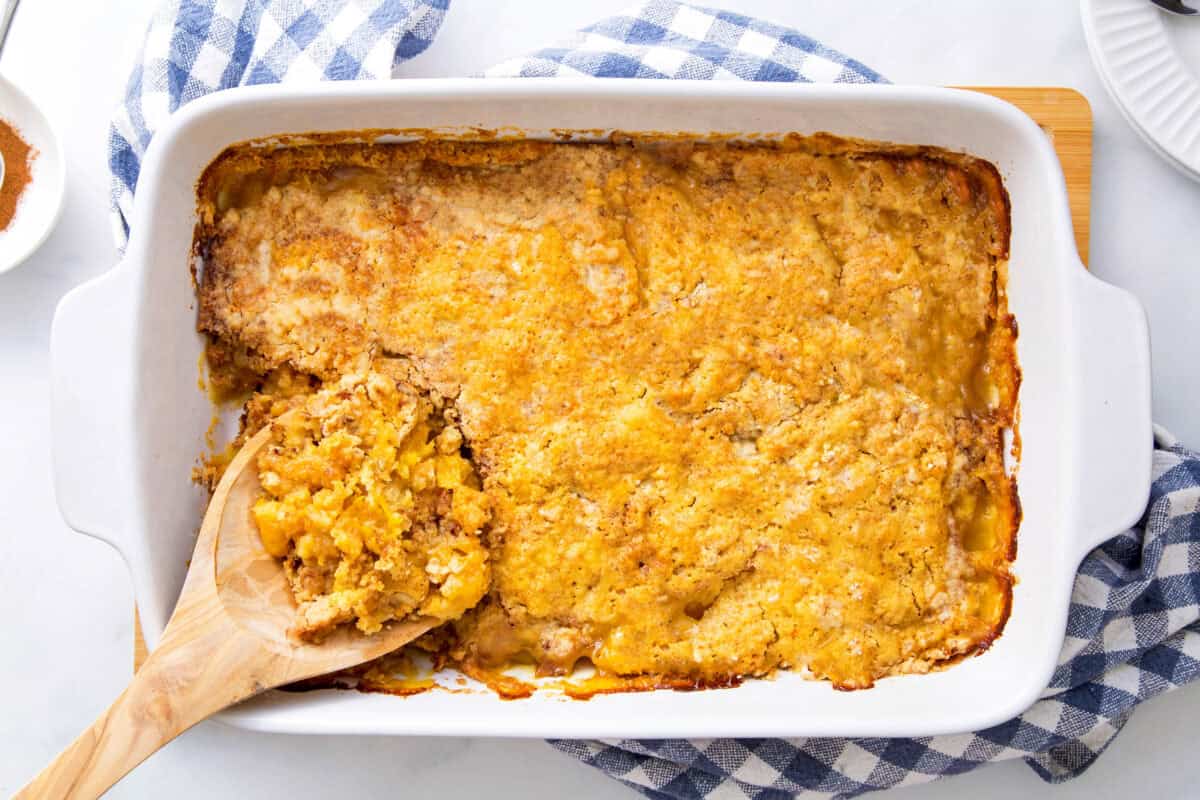finished peach cobbler in a baking dish. 