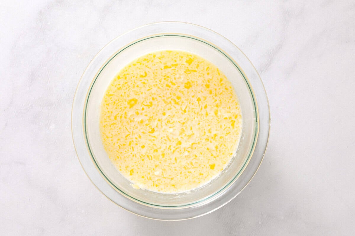 Wet ingredients for homemade pancakes in bowl.