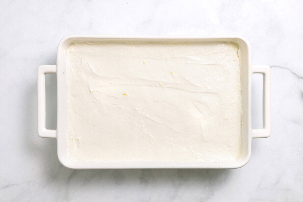 Overhead view of cheesecake layer for lemon blueberry delight