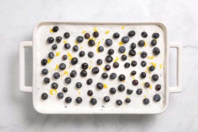 Overhead view of lemon blueberry delight after adding topping