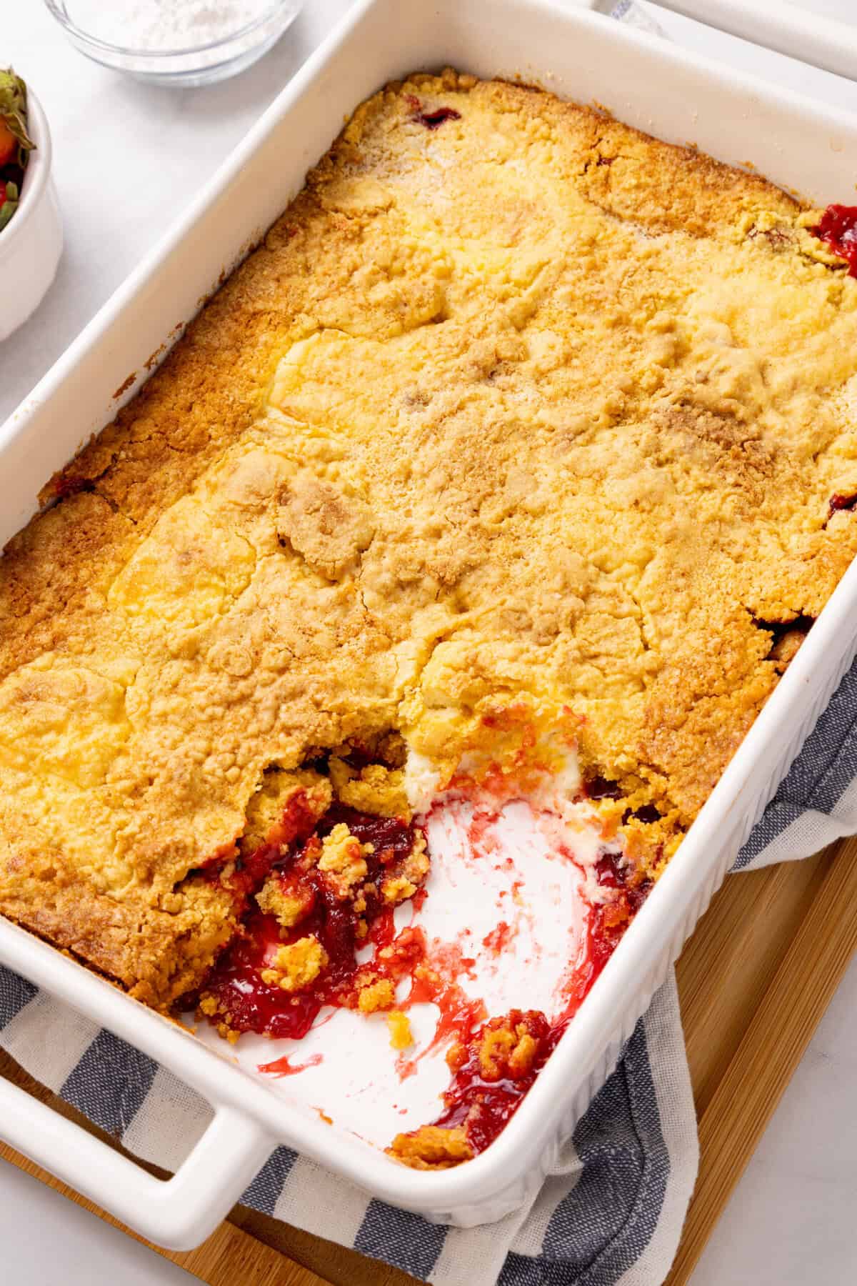 Strawberry cheesecake dump cake in a baking dish. 