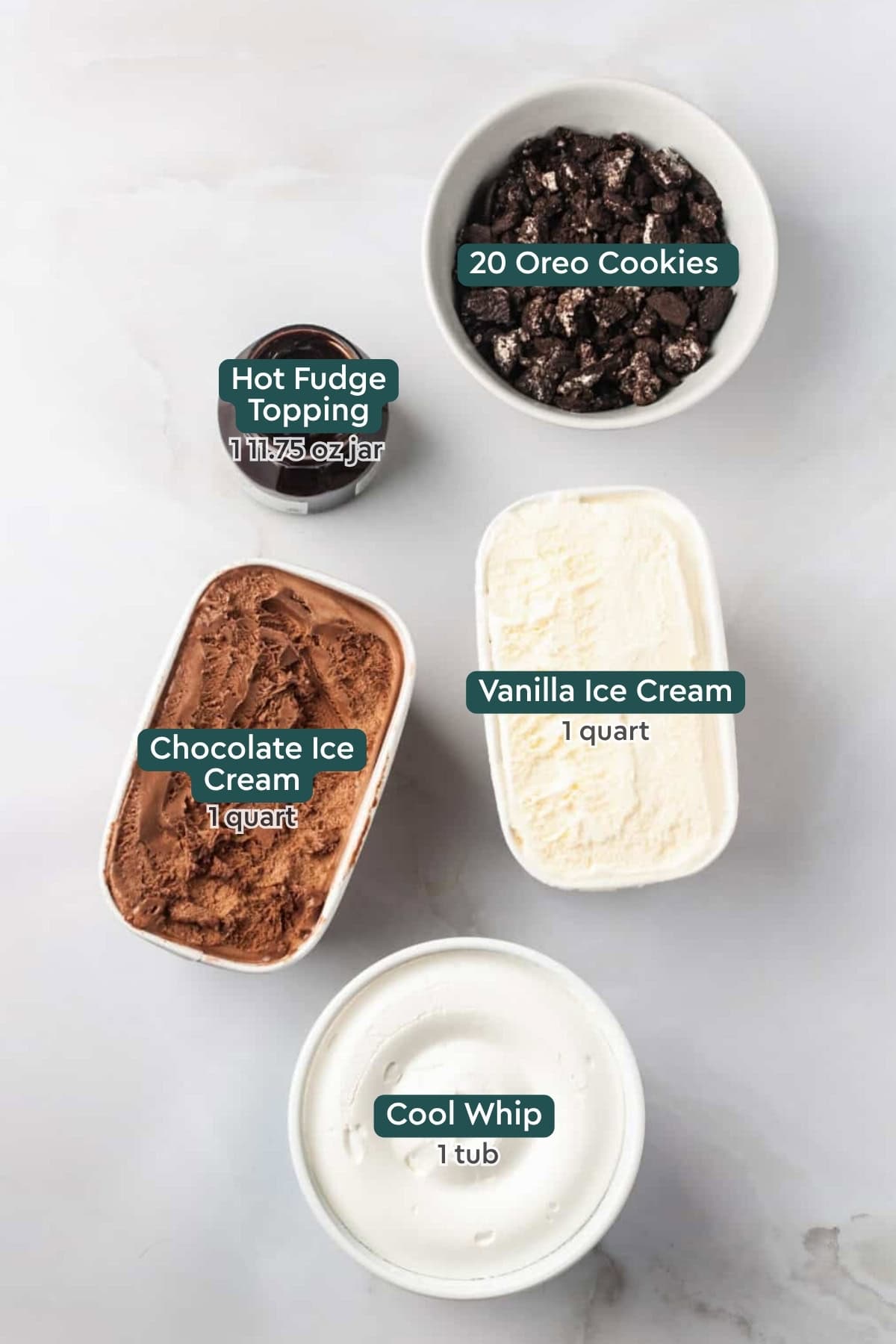 Ingredients for dairy queen ice cream cake, including oreos, fudge, vanilla and chocolate ice cream, cool whip.