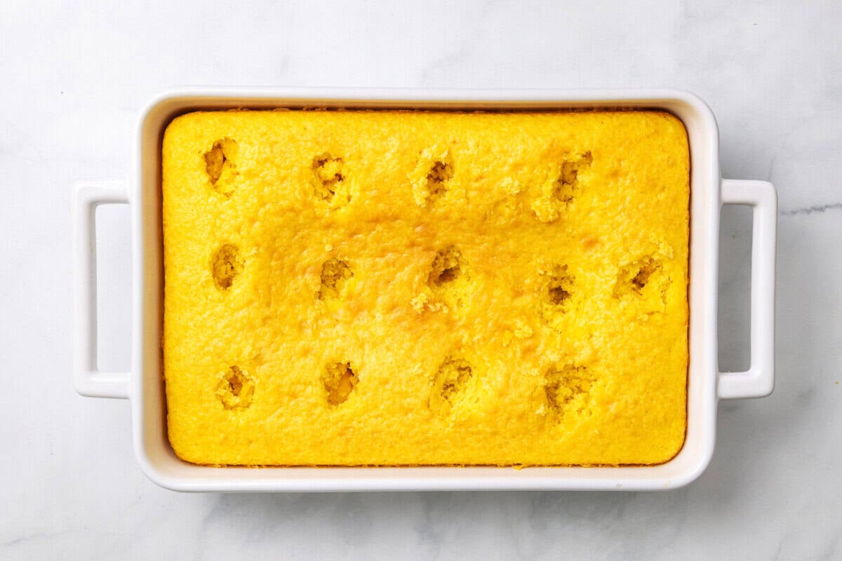Lemon cake with holes poked in it.