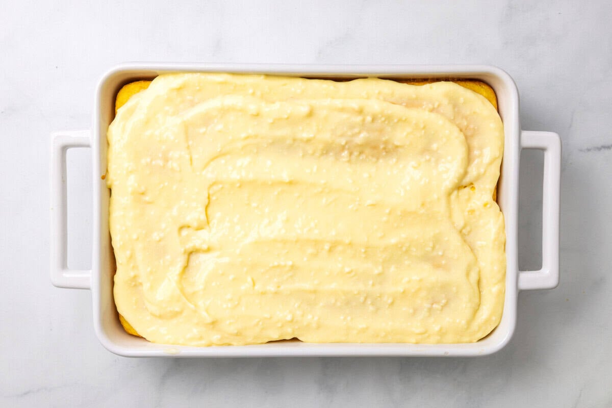 Pudding spread over cake.