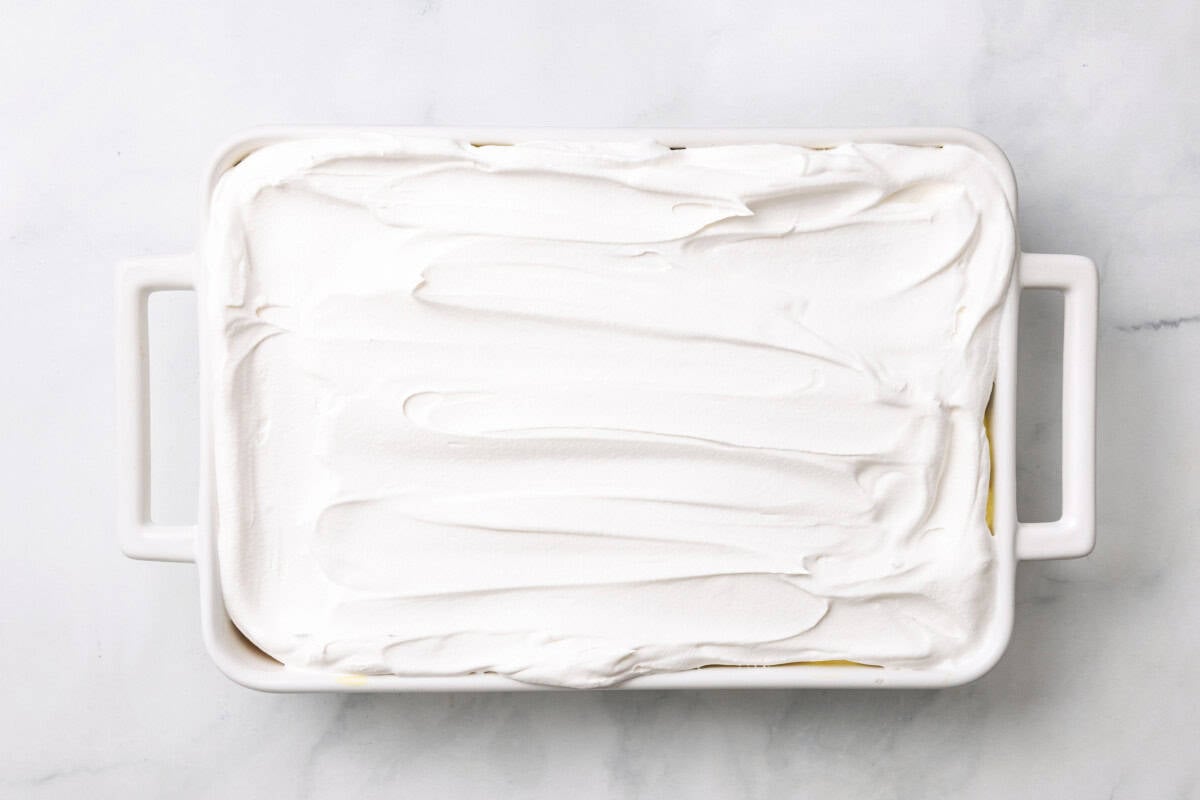Whipped topping spread over cake.