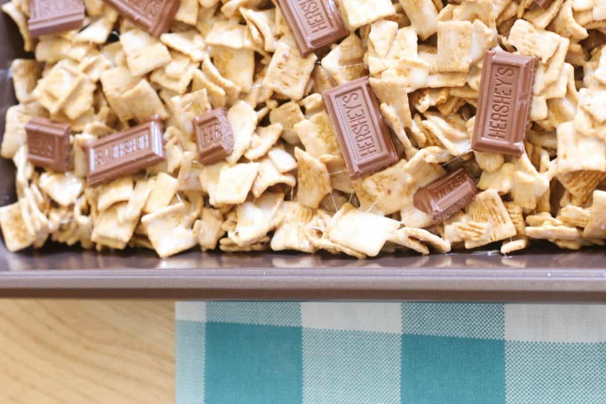 S'Mores Bars made with only 4-ingredients - Golden Grahams cereal, Hershey chocolate bars, marshmallows, and butter! It's the EASIEST no-bake dessert bar recipe ever!