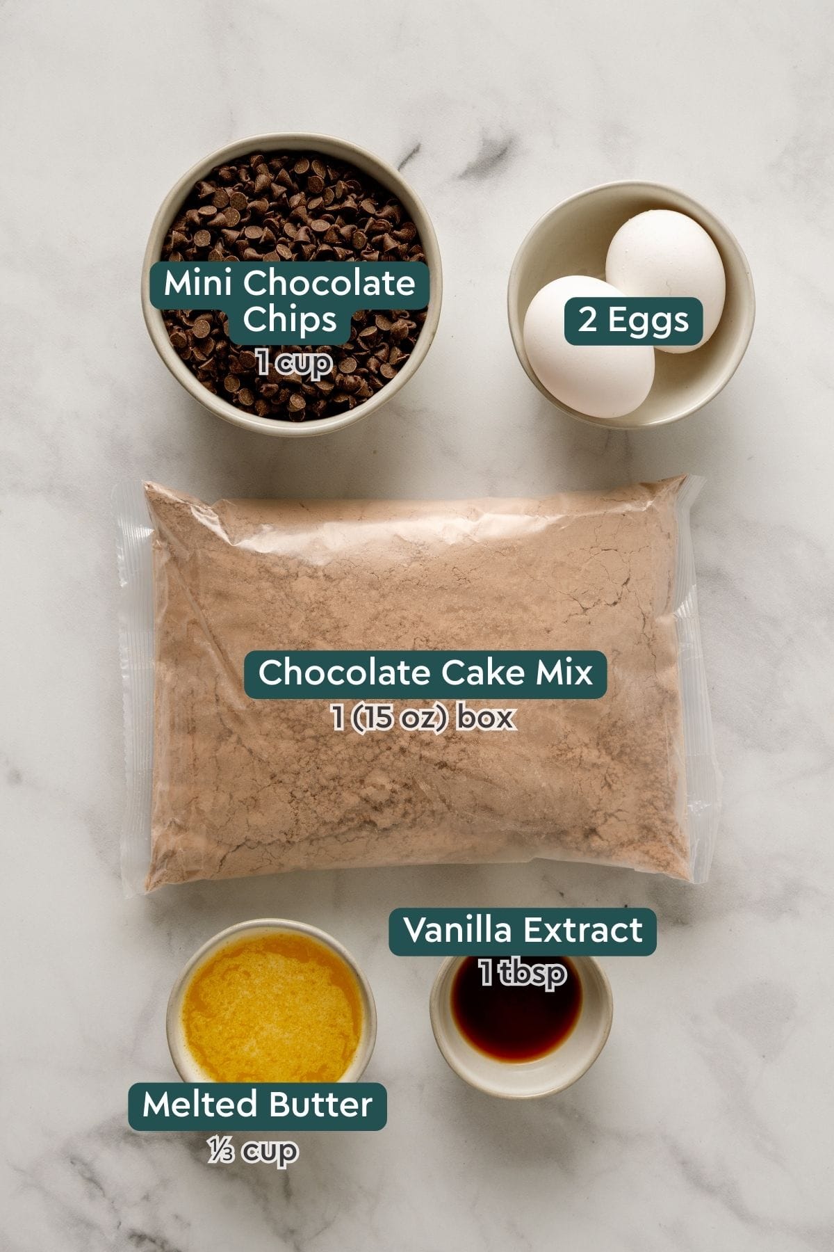 All of the ingredients for boxed cake mix brownies on a white countertop.