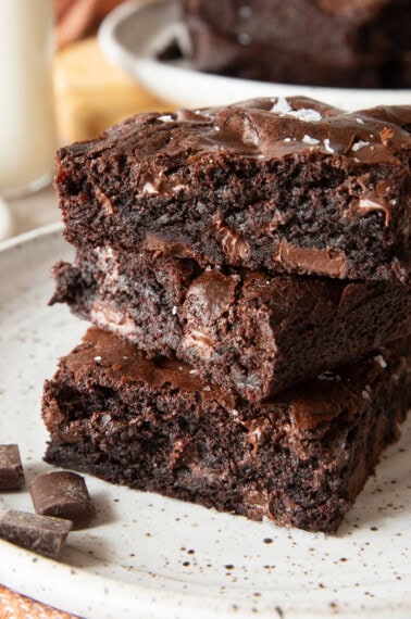 Chick-fil-a brownies with chocolate chunks stacked on top of eachother.