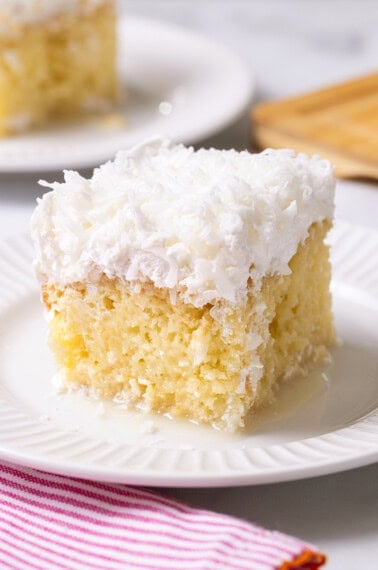Coconut poke cake made with box cake mix.