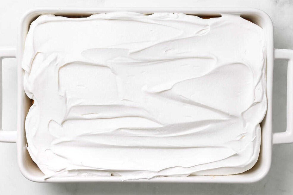 Cool Whip Topped coconut poke cake.