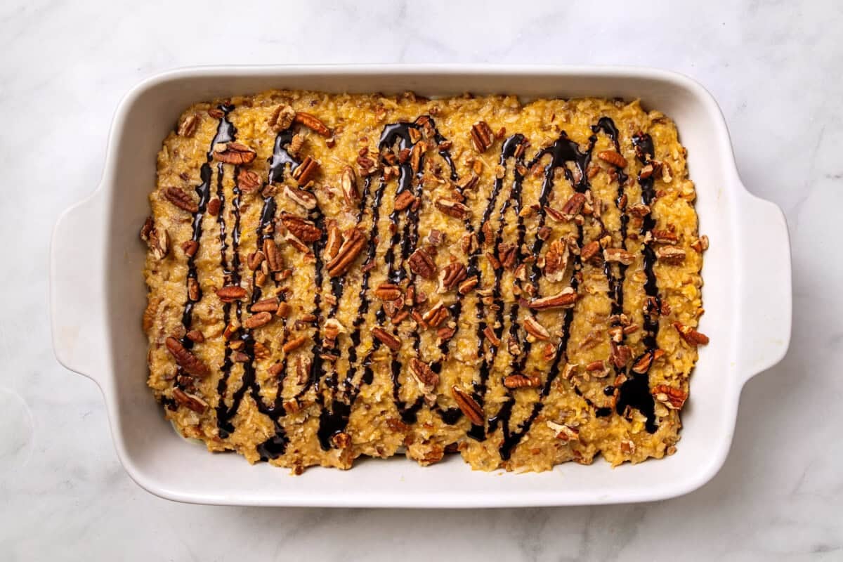German chocolate poke cake in baking dish.