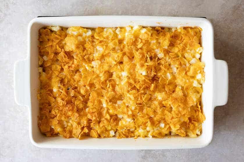 cooked easy cheesy potatoes in baking dish.