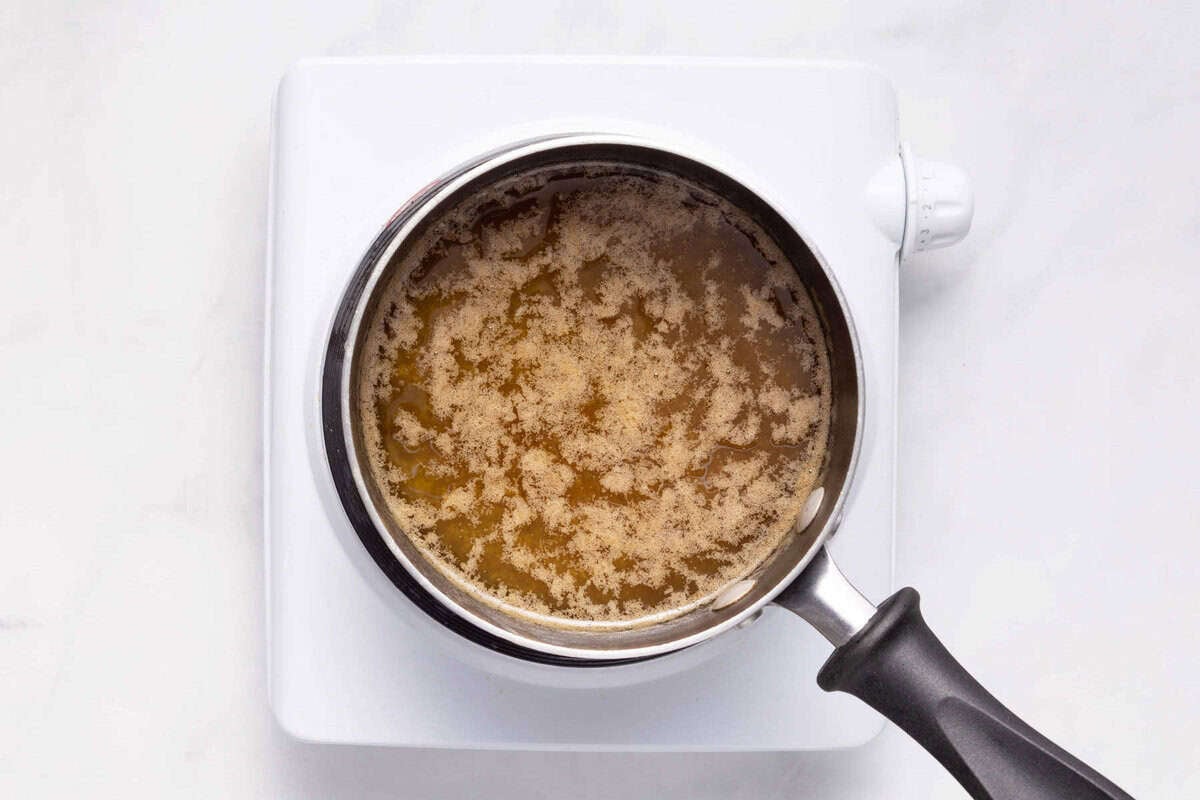Cinnamon sauce simmering in saucepan.