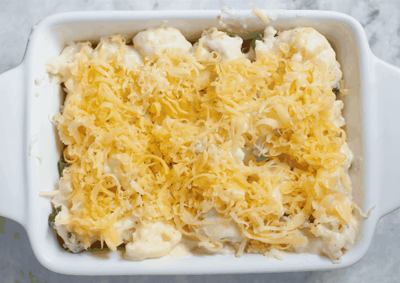Cauliflower in casserole dish topped with cheese.