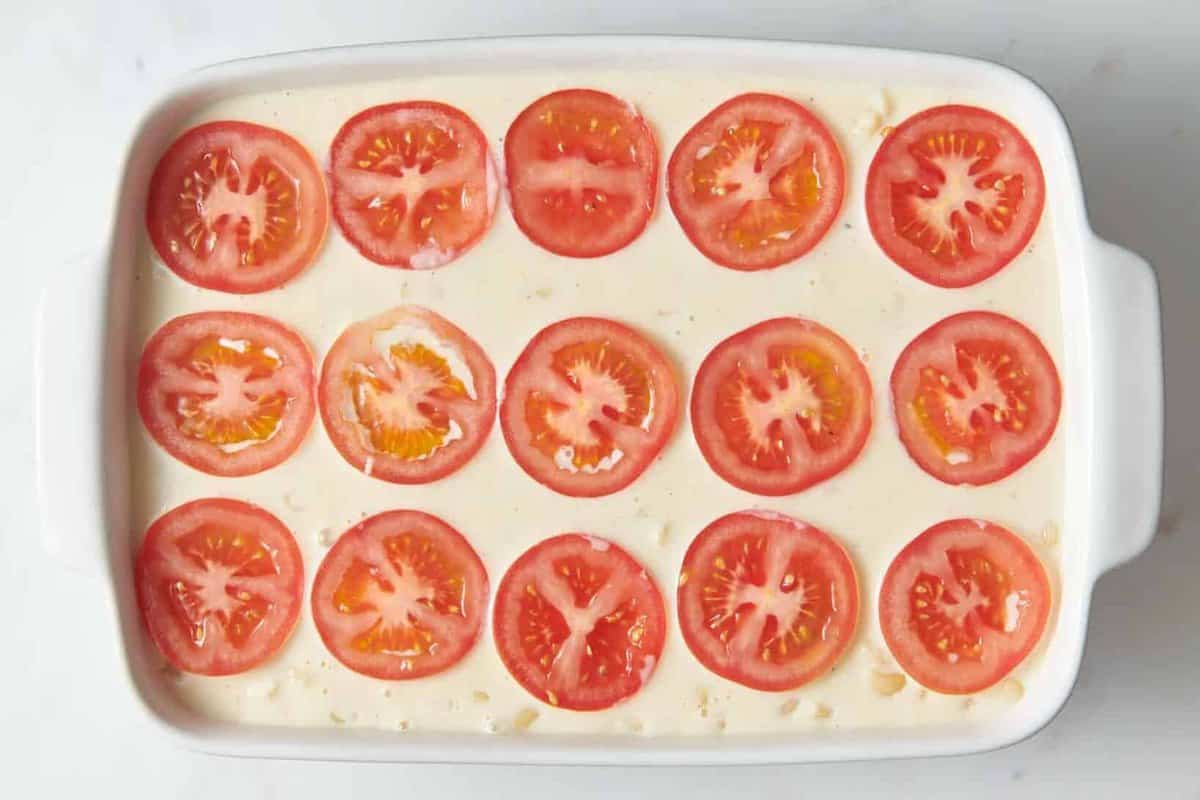 Tomatoes laid on top of Ina Garten mac and cheese.
