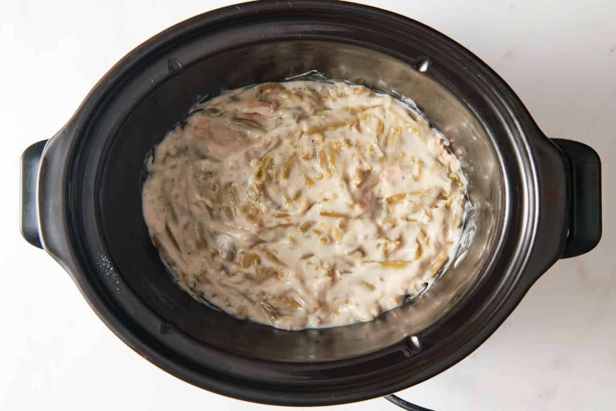 Green bean casserole in crockpot before adding topping.