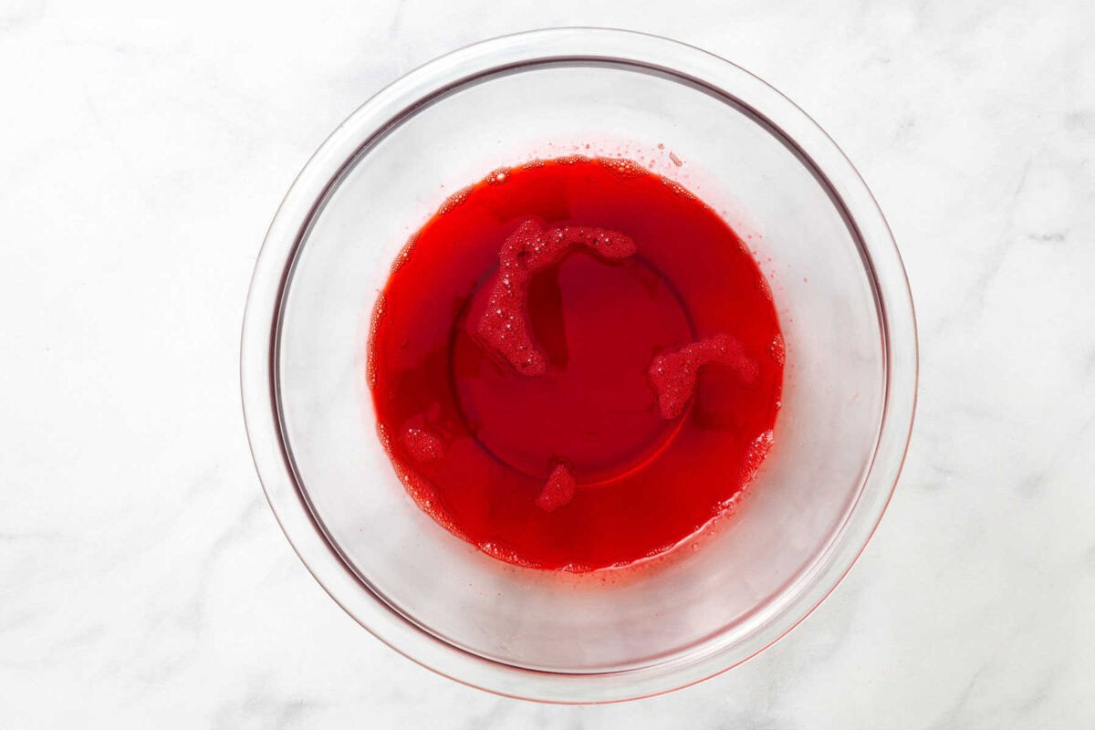 Jello being mixed in a bowl.