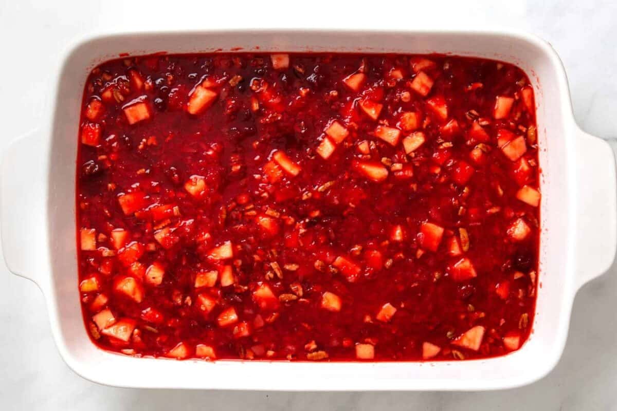 Chilled cranberry jello salad in a bowl. 