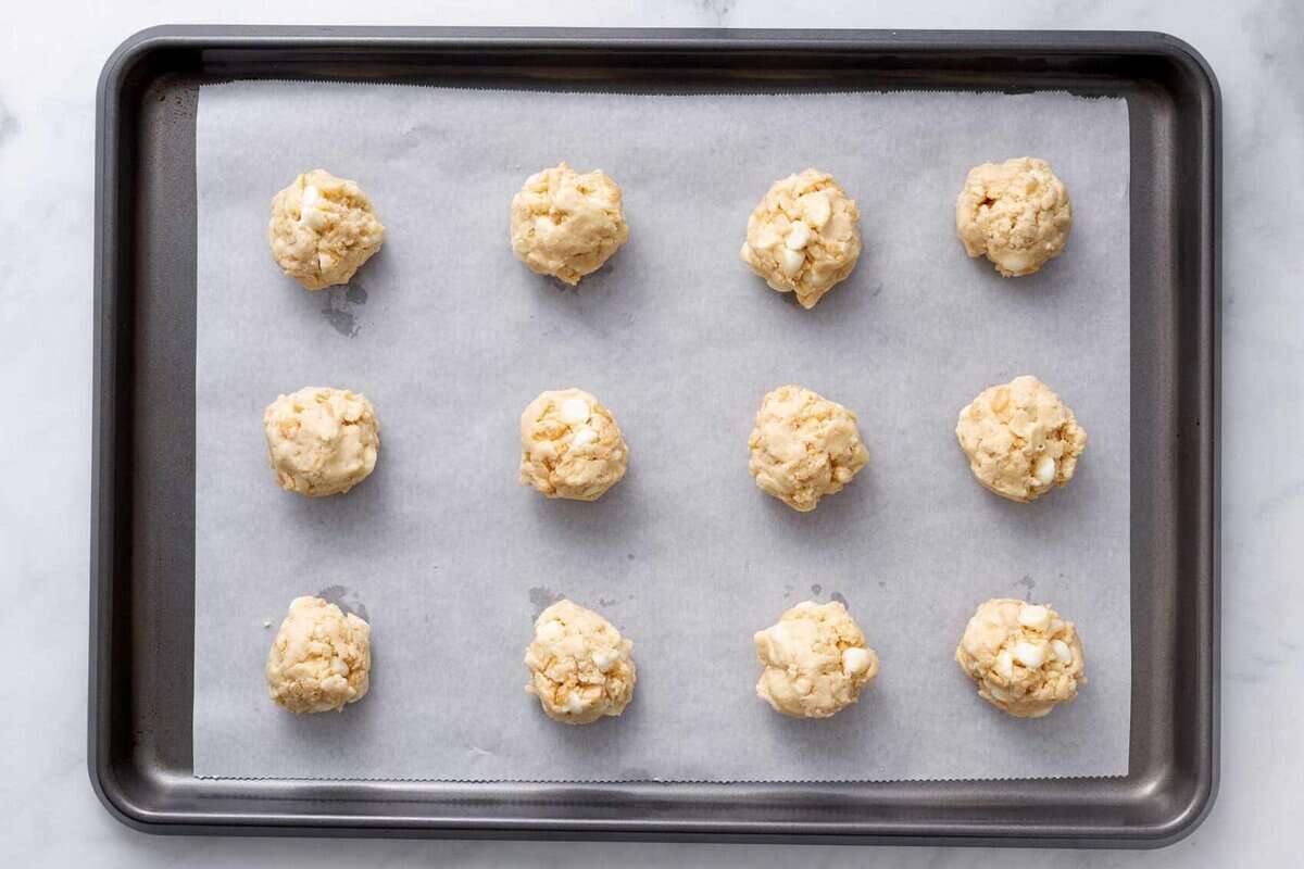 Rice krispie cookies scooped onto parchment paper.