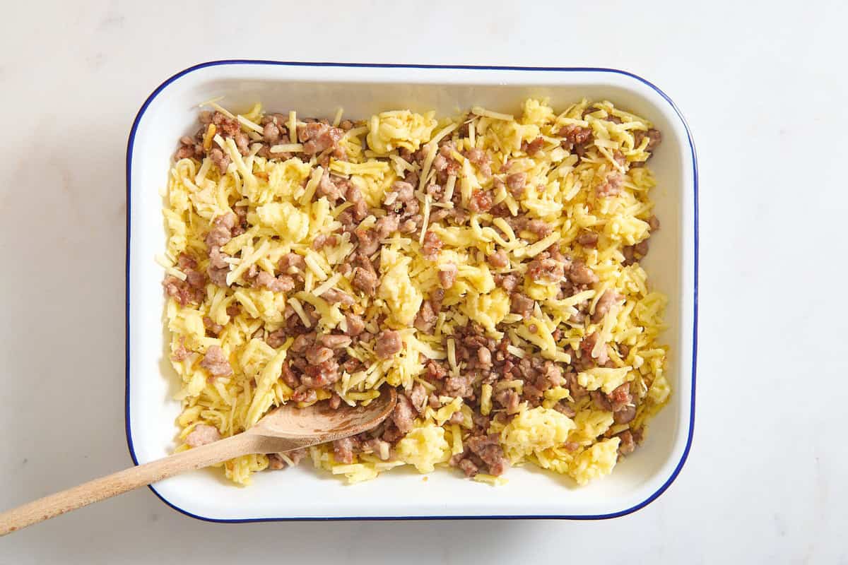 Hashbrowns and sausage in pan.