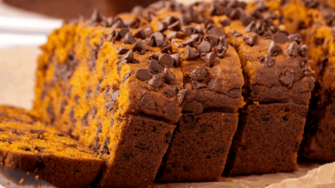 side shot of sliced pumpkin chocolate chip bread