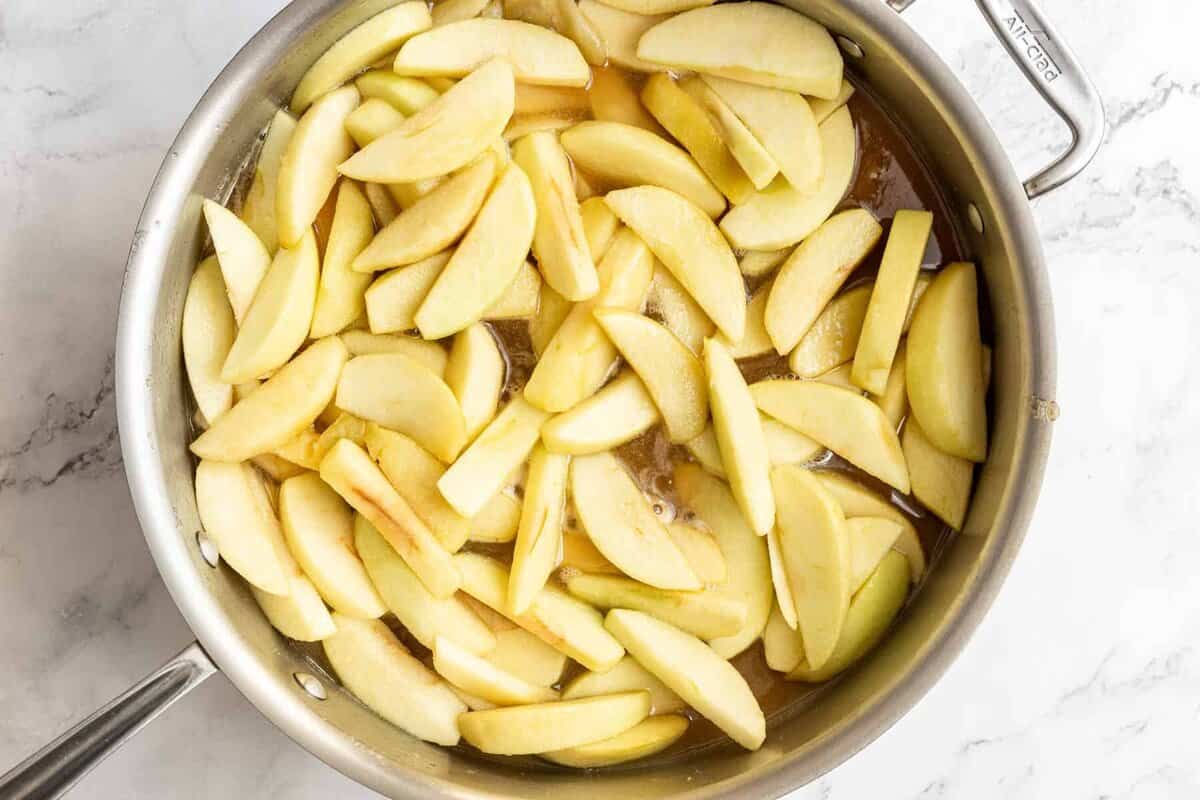 Apples added to skillet for making fried apples.