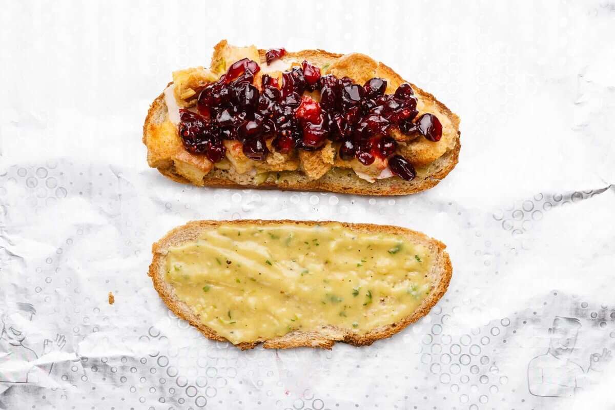 Two halves of a Thanksgiving leftover sandwich.