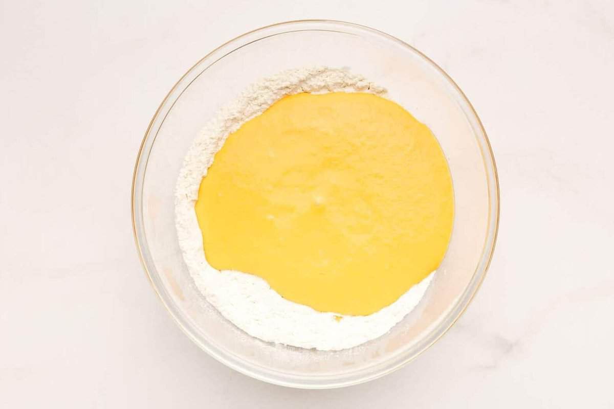 Ingredients for sweet potato waffles in a bowl. 