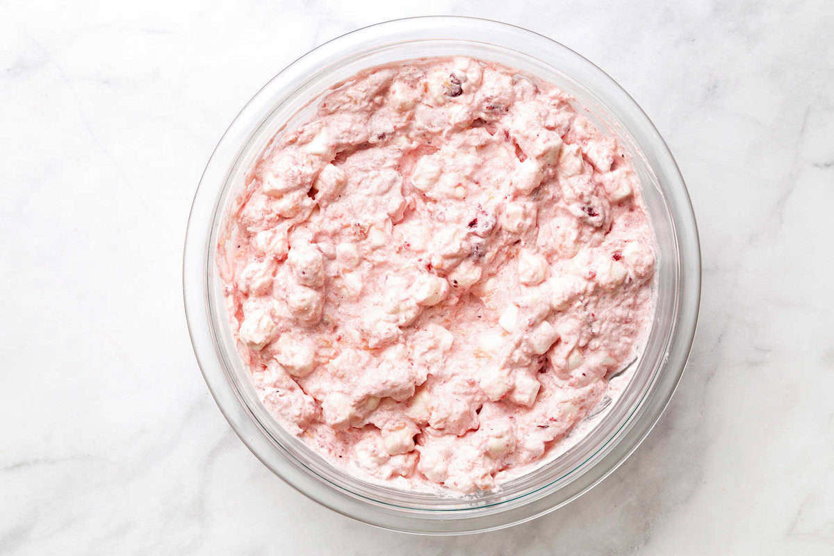 Cool Whip, vanilla extract, salt, and mini marshmallows in a bowl.