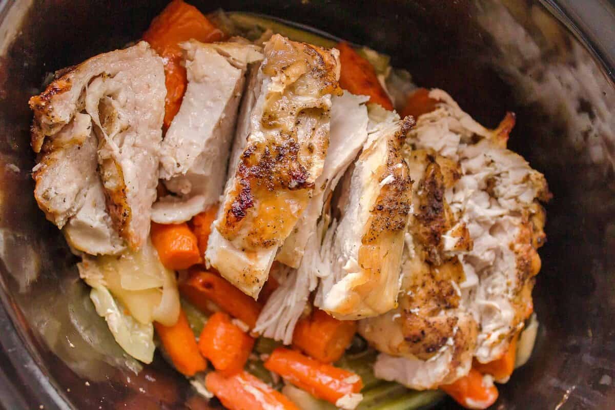 slow cooker turkey breast with carrots and celery in a slow cooker