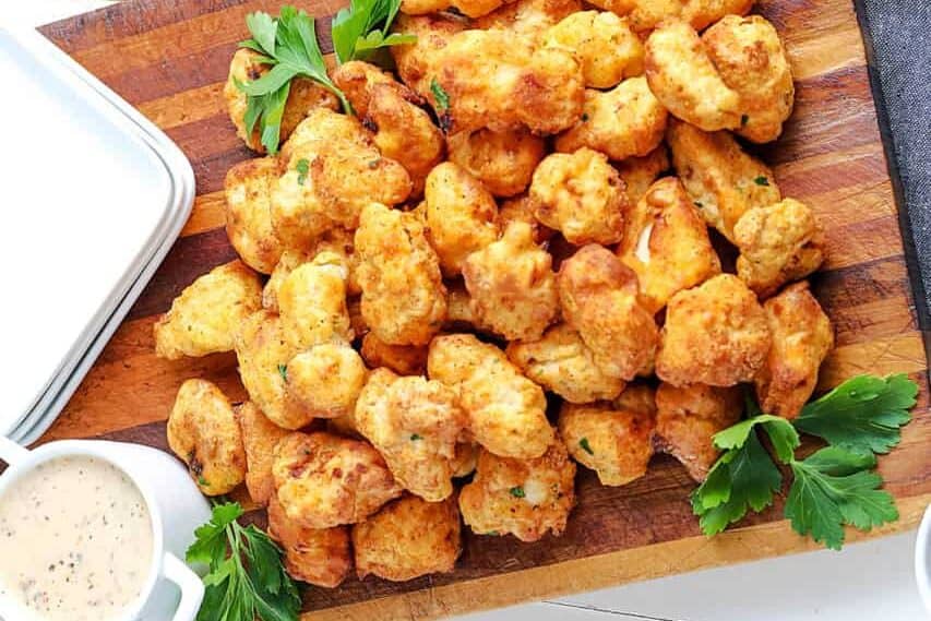 air fryer popcorn chicken on a cutting board