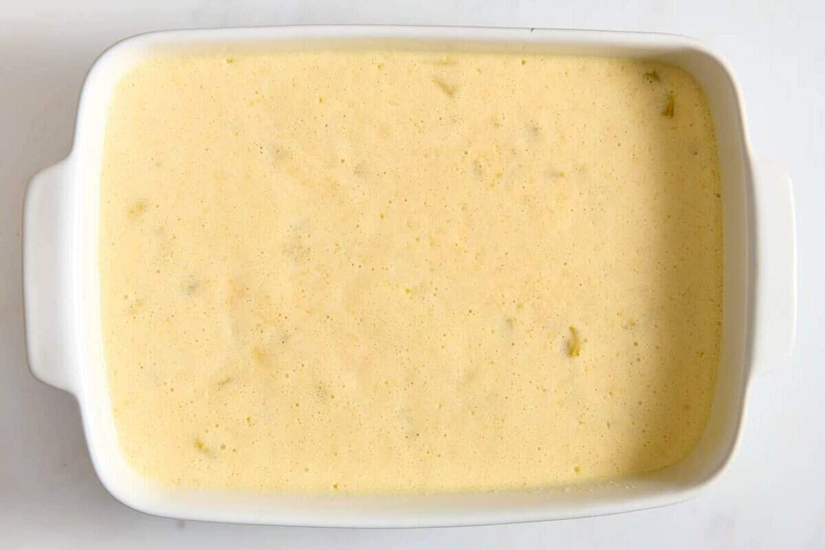 Green chile egg casserole before baking.